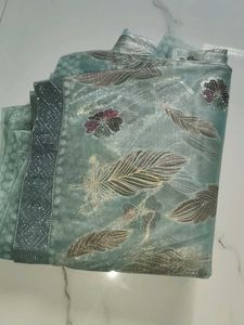 Elegant Teal Saree with Feather Motifs