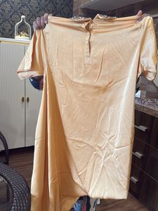 Elegant Peach Top with Embellished Collar