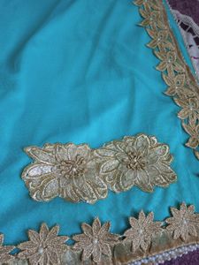 Elegant Turquoise Saree with Golden Embellishments