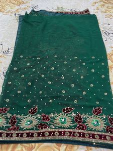 Elegant designer heavy work green  georgette saree