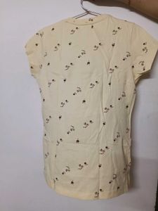 Peach coloured short sleeved tshirt
