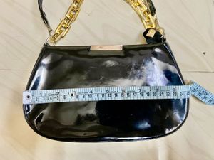Chic Black Patent Handbag with Gold Chain