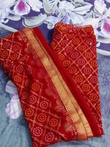 Vibrant Red Bandhani Saree with Gold Border