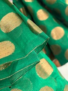Green fabric with Gold Polka Dots