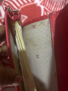 Red Sling Bag With CHANEL Logo