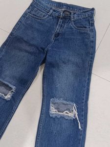 Ripped Knee Blue Jeans