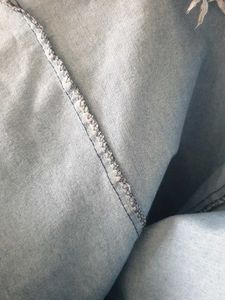 Light Wash Bell Bottom Jeans with Fringed Hem