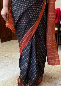 Elegant Black Saree with Orange Border