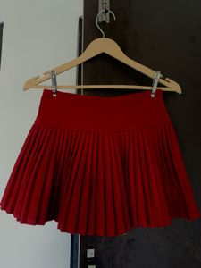 Red Pleated Skirt with Bows