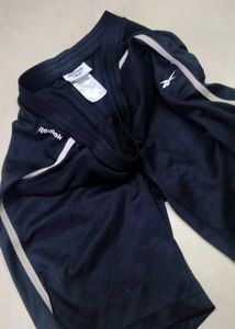 Reebok training shorts.