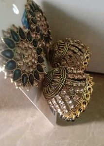 Gold Jhumka Earrings with Black Stones