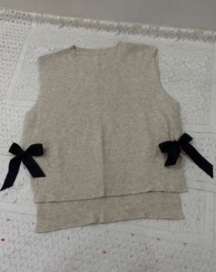 Cream Ribbed Vest Sweater with Black Bow detailing