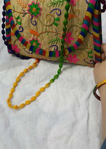 Embroidered Clutch Bag with Beaded Strap