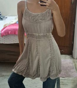sleeveless dress over jeans top