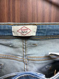 Distressed Light Wash Denim Jeans