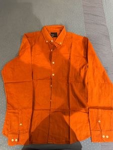 orange shirt from snitch