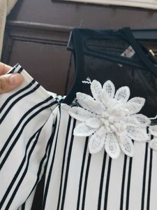 Chic Striped Cold Shoulder Dress with Flower Detai
