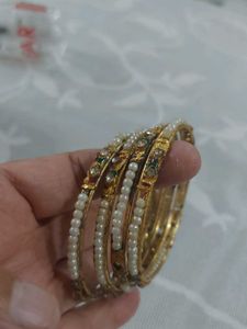 Elegant Gold Tone Bangles with Pearl Accents