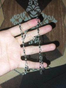 Anklet with black beads and charms