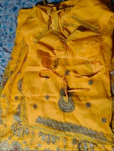 Embroidered Yellow Rajasthani poshak.