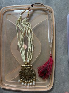 Elegant Pearl Necklace with Antique Pendant