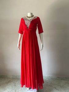 Elegant Red Gown with Embellished Neckline