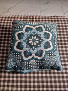Decorative Red Floral Cushion with Blue Cover