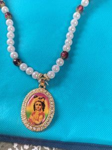 Beaded Necklace with Religious Pendant