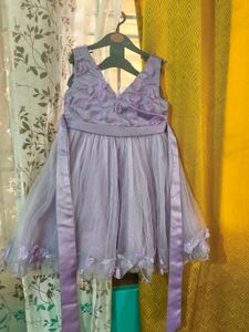 Sparkly Star Dress with Bow. colour is more bright