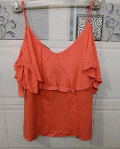 Coral coloured chic and elegant top