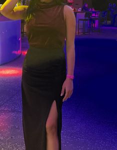velvet maroon top paired with long black skirt wit