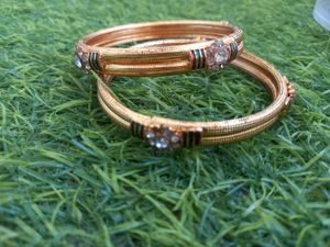 Elegant Gold Bangles with Stone Embellishments