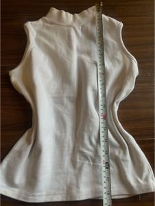 White fitted high-neck sleeveless top