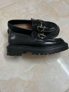 Classic Black Loafers with Gold Buckle