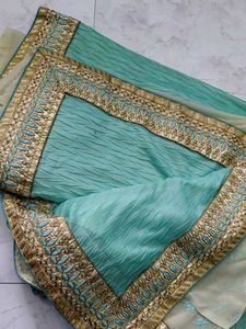 Elegant green Saree with Gold Border