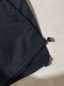 Black trendy parachute pants with adjustable lows