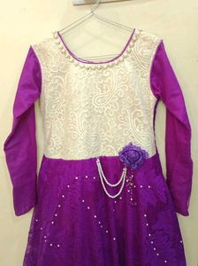 Elegant Purple Gown with Pearl Embellishments