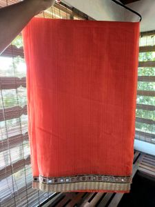 Vibrant Orange Saree with Mirror Work Border