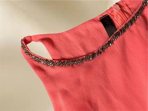 Chic Coral Layered Top with Embellished Neckline