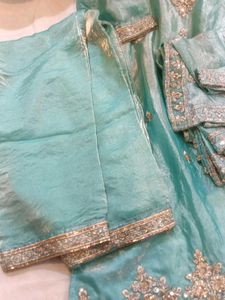 Exquisite Teal Kurta Set with Intricate Embellishm