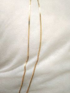 golden chain with ruby pendent
