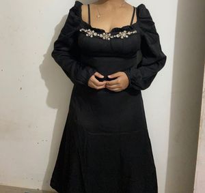 Elegant Black Dress with Embellished Neckline