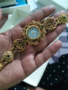 Exquisite Gold Tone Watch with Gemstones
