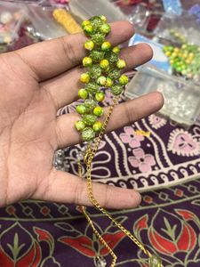 Green &amp; Yellow Beaded marble coloured Bracelet