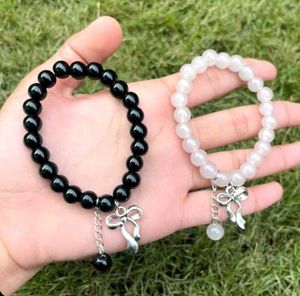 pair ribbon Beaded Charm Bracelets