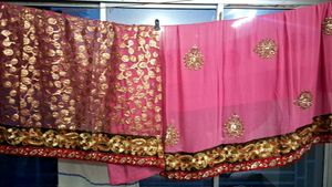 Elegant Pink Saree with Intricate Embellishments