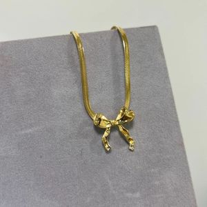anti tarnished Gold Tone Bow Necklace