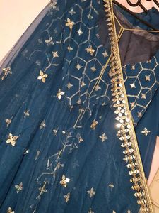 Stunning Teal lengha choli with Silver Embellishme
