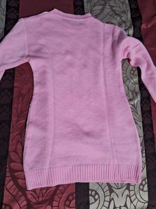 cute pink woole  top with white design and stones