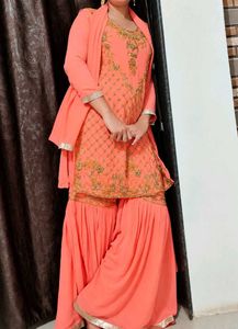 Exquisite Peach Embellished Sharara Set
